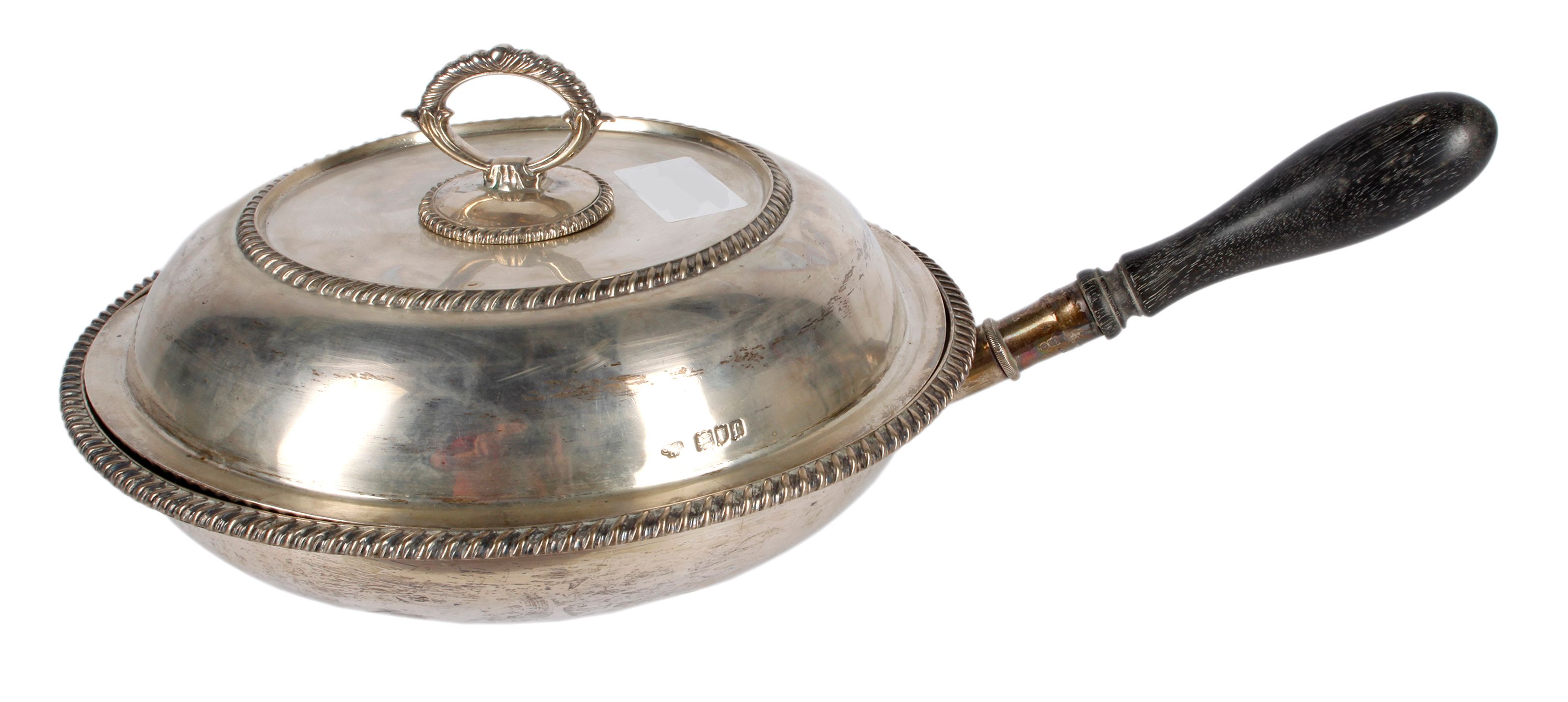 A silver vegetable dish with divisioned interior