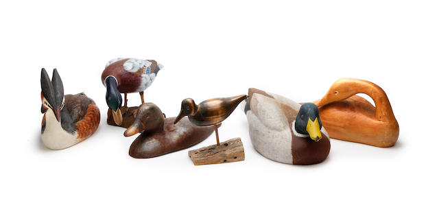 A group of three modern duck decoys