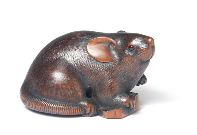 A wood netsuke of a rat By Ikkan, Nagoya, 19th century