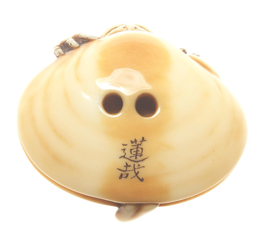 An ivory netsuke of a kappa on a clam By Rensai, late 19th century