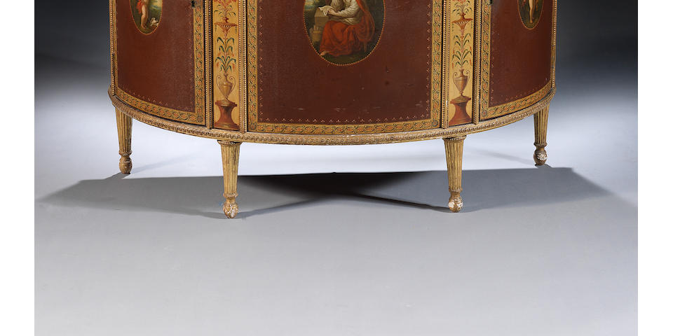 A George III japanned, polychrome decorated and parcel gilt demi-lune commodeattributed to George Brookshaw, the painted panels after Angelica Kauffmann