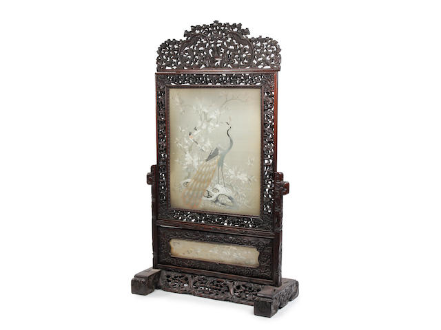 A Chinese carved hardwood stand with embroidered panel Late 19th Century
