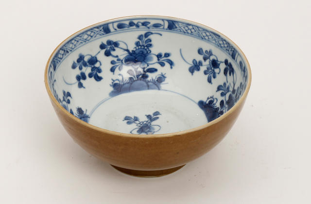 A Chinese blue and white bowl with cafe-au-lait glaze Early 18th Century
