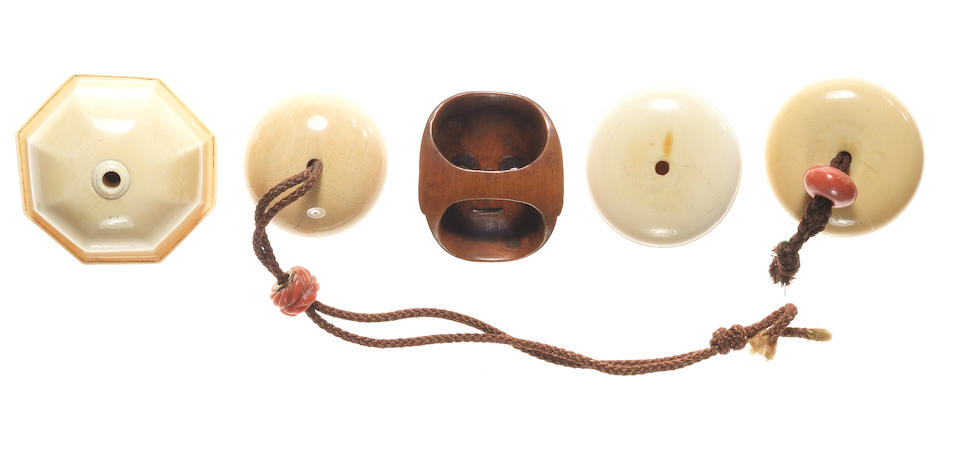 Four kagamibuta, one ivory manju and three wood miniature mask netsuke 19th century