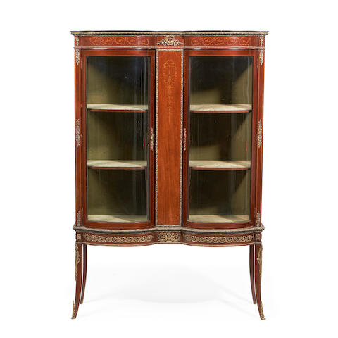 A Louis XVI style brass mounted mahogany and fruitwood inlaid vitrine