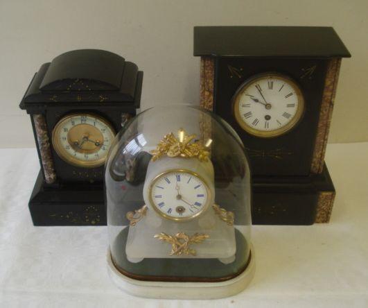 A 19th Century gilt metal mounted alabaster mantel clock,the 3" dial with blue enamel Roman chapter in oval plinth and glass dome, and two coloured marble and polished slate cased mantel clocks. (3)