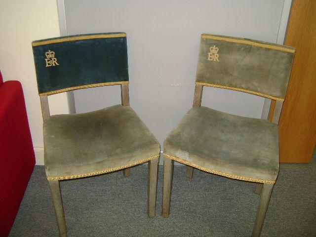 ROYAL INTEREST: A pair of chairs for the coronation of Queen Elizabeth II, numbered 11 and 12, some fading, (2).