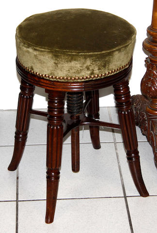 A Regency mahogany revolving piano stool