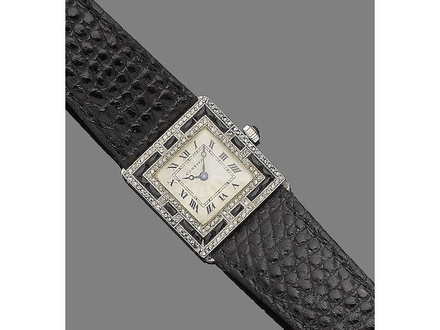An art deco onyx and diamond wristwatch, by Cartier,