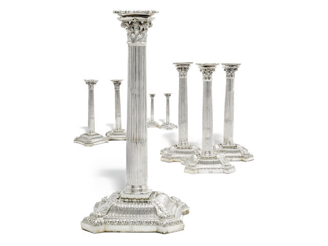 Eight 18th century silver candlesticks only one with visible hallmark to base (remainder of bases filled), by Thomas Hemming, London 1756, four drip pans part marked  (8)