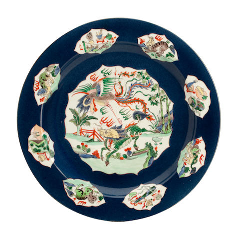 A Kangxi style charger in famille verte on powder blue Bearing lozenge mark but probably 19th century