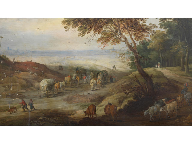 Jan Brueghel the Younger (Antwerp 1601-1678) and Joos de Momper (Antwerp 1564-1635) A country path with several wagons and other travellers on foot, a cowherd and his livestock leaving a woodland track in the foreground and an extensive landscape with two distant towns beyond