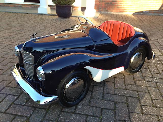 A modified Austin J40 pedal car, converted to petrol power,
