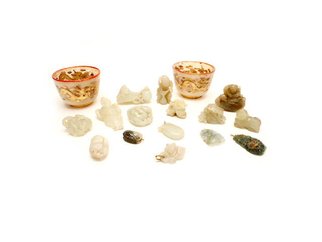 A pair of jadeite or hardstone cups and a group of jade and other hardstone items