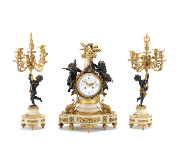 An early 20th century French parcel gilt and patinated bronze and white marble figural clock garniturethe brass movement marked Vincenti