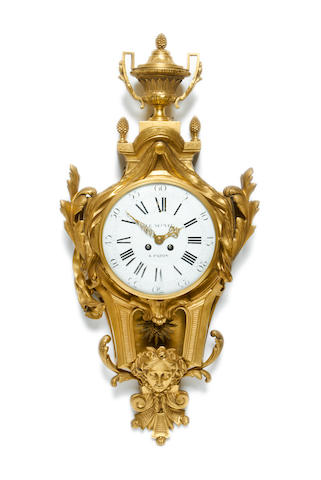 A late 19th century gilt bronze cartel clockin the Louis XV style the dial signed LE NEPVEU A PARIS