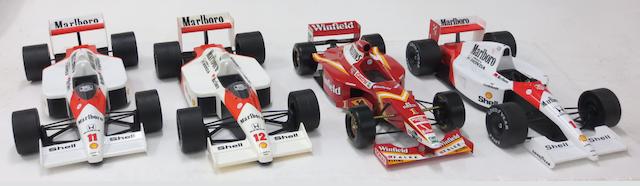 Four 1:5 scale promotional models of Formula 1 cars,