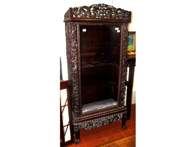 A Chinese carved hardwood display cabinet on stand,