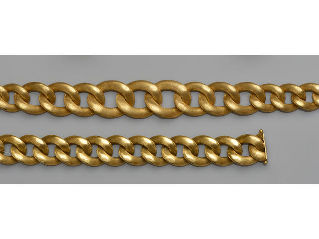 An 18ct gold curb-link necklace and bracelet suite (2)