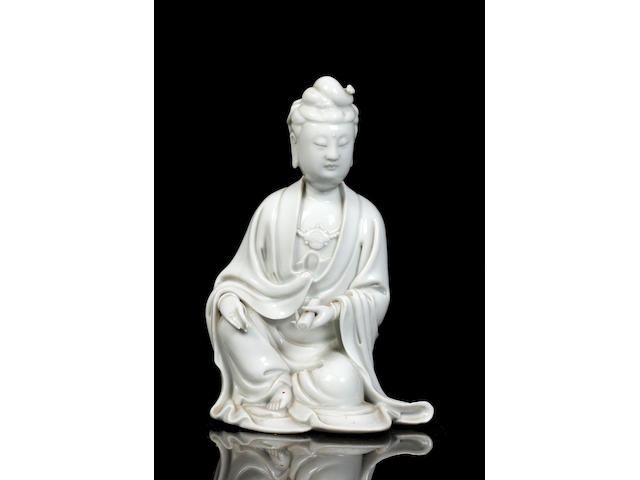 A Chinese blanc-de-chine figure of a seated Guanyin