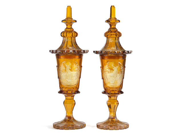An impressive pair of Bohemian amber-stained goblets and covers, circa 1840-60