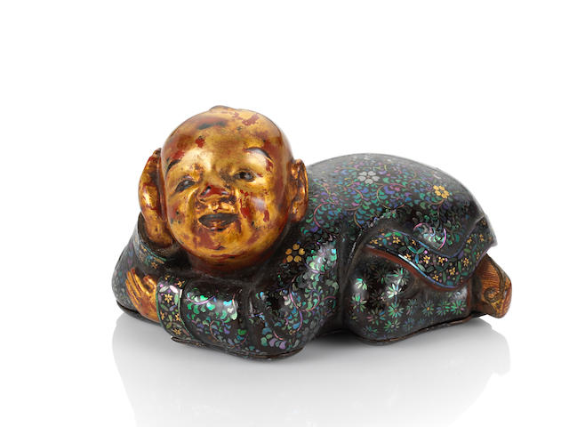 A very rare lac burgaut&#233; 'crouching boy' snuff box and cover Inlaid Qianlong four-character mark and of the period