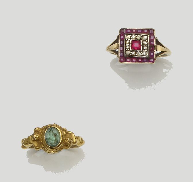 An emerald figural ring and a ruby and diamond panel ring (2)