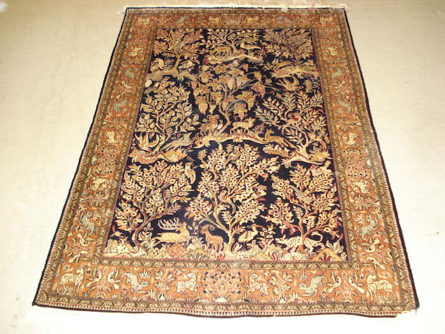 A silk Ghom rug, Central Persia, 158cm x 105cm