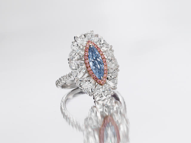 A fancy coloured diamond and diamond dress ring