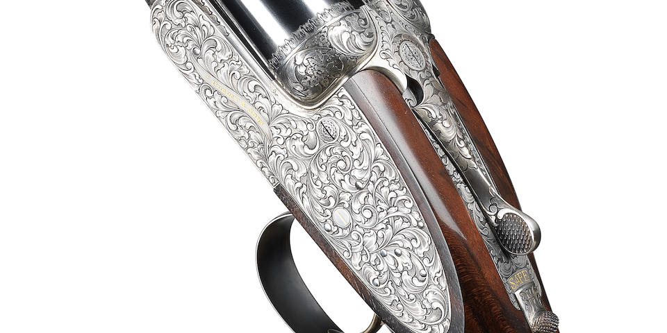 A fine Chung-engraved 12-bore (2&#190;in) single-trigger self-opening sidelock ejector gun by J. Purdey & Sons, no. 30145 In its brass-mounted oak and leather case with canvas cover and makers accessories