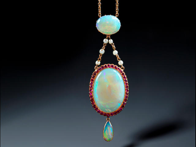 An opal and ruby cluster pendant