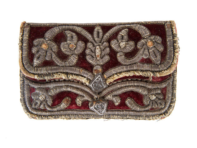 A mid 17th century embroidered velvet purse