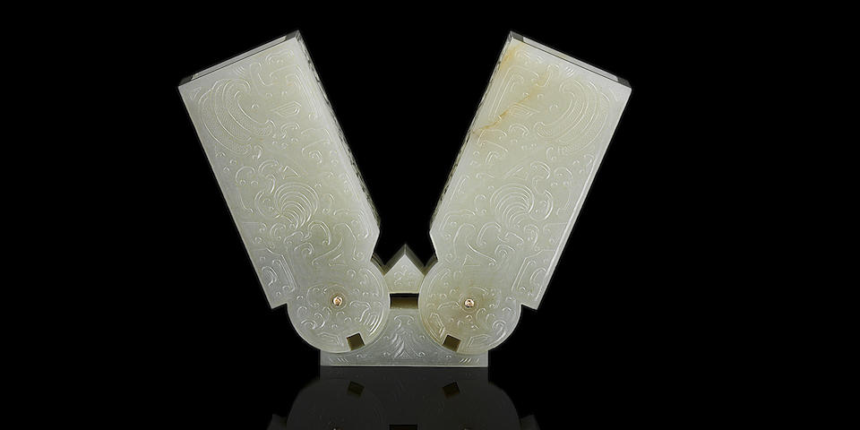 A rare Imperial white jade archaistic 'hinge fitting' Qianlong six-character fang gu mark and of the period