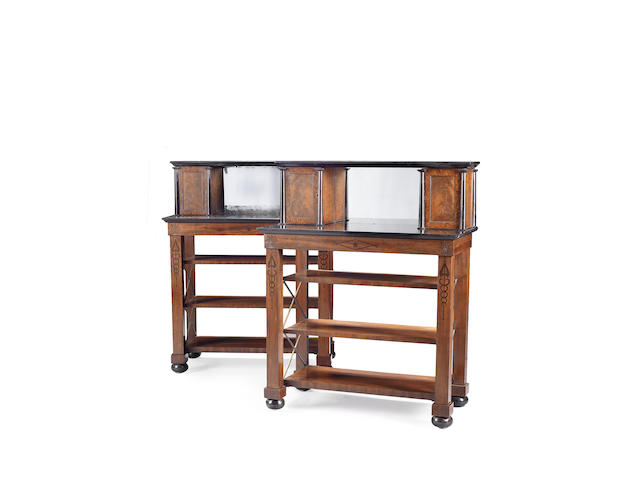 A pair of Regency mahogany, ebonised and black marble side cabinetsin the manner of Marsh and Tatham
