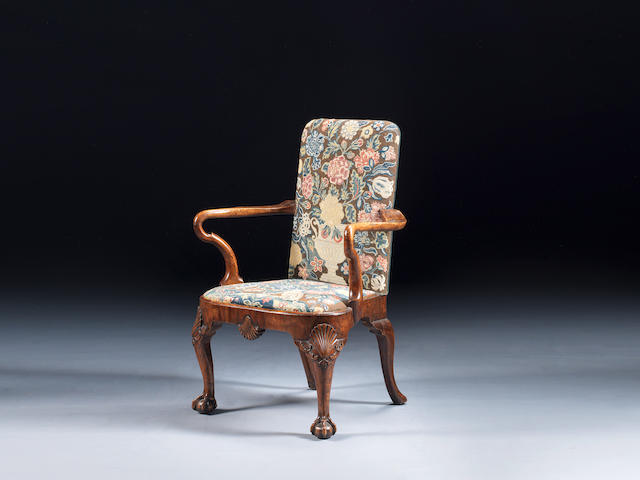 A George I walnut armchair upholstered in the original 18th century petit point needlework