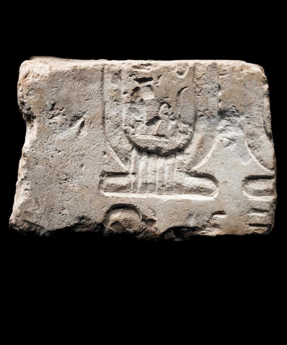 An Egyptian limestone double-sided relief fragment for Nefertiti