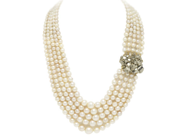 A multi-strand cultured pearl necklace with pyrite clasp, by Grima, (illustrated inside the front cover)
