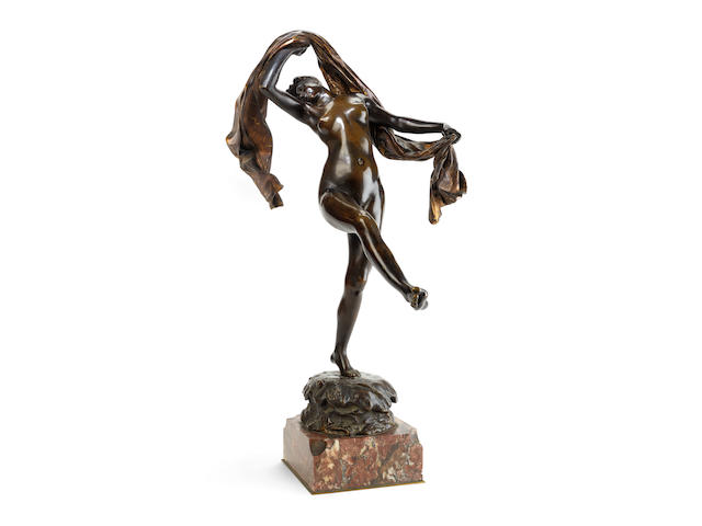 Louis-Ernest Barrias, French (1841-1905): A patinated and parcel gilt bronze figure of 'The Scarf Dancer'