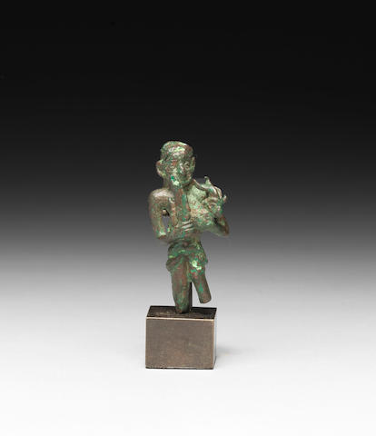 A small Elamite bronze figure of a sacrificing man