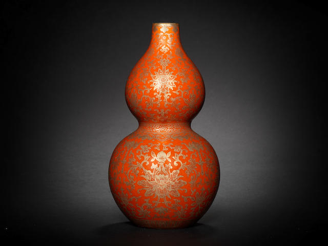 A rare Imperial coral-ground gilt-decorated double-gourd vase Jiaqing seal mark and of the period