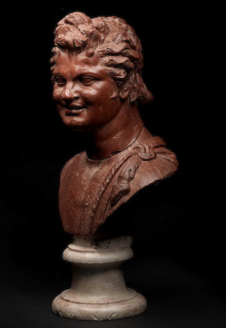 A Roman rosso antico marble head of a satyr