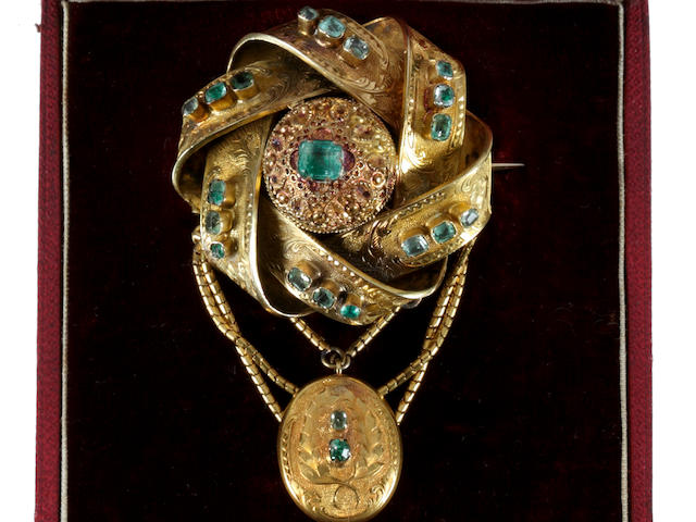 A Victorian gold and emerald brooch and a pendant and earrings ensuite