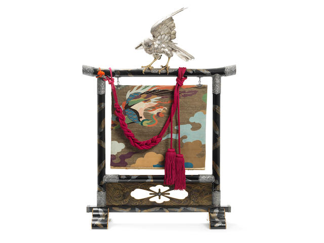 A silver okimono of a hawk on a black lacquer tall perch for the tokonoma (tea-room alcove) The hawk by Shoami Yoshihiro, the lacquer perch by Kanshosai Toyo II, Meiji Period