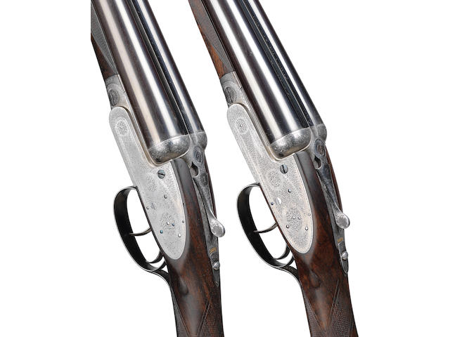 A pair of 12-bore self-opening sidelock ejector guns by J. Purdey & Sons, no. 20542/3 In their brass-mounted oak and leather case with a later canvas cover