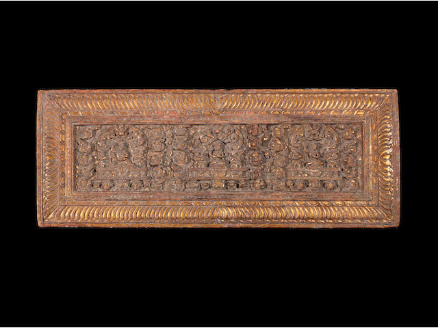 A carved gilt-wood manuscript Cover Tibet, 16th Century