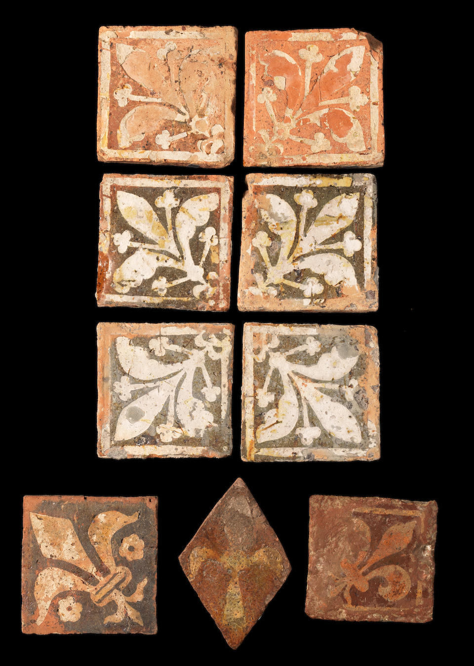 Nine various Medieval encaustic floor tiles, 14th-15th century