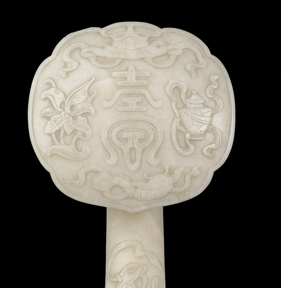A 'chicken-bone' jade 'Eight Buddhist Emblems' ruyi 19th century