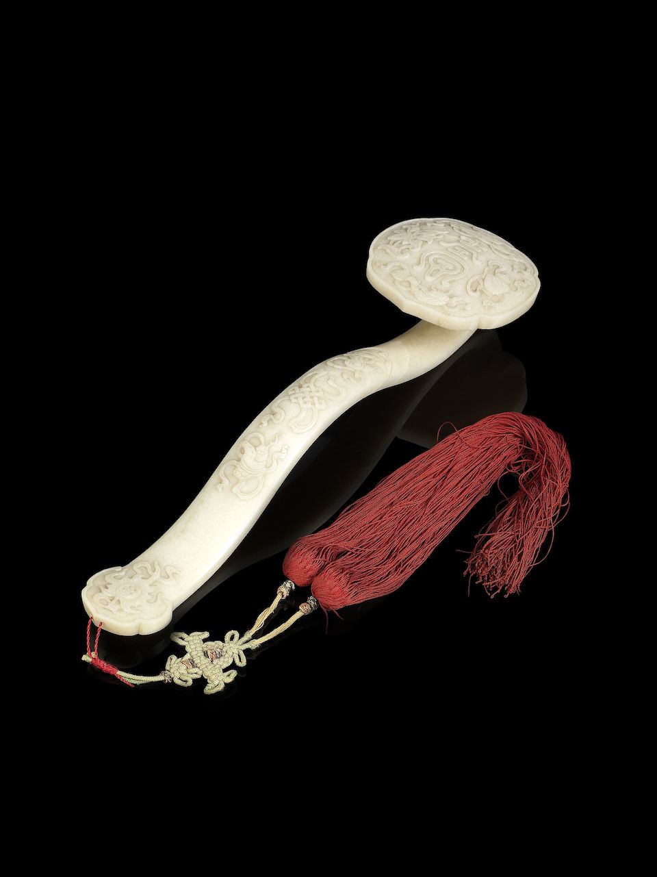 A 'chicken-bone' jade 'Eight Buddhist Emblems' ruyi 19th century