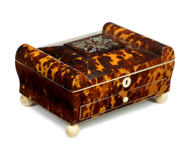 A Regency tortoiseshell ivory and mother of pearl inlaid sewing box