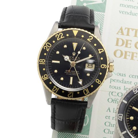 Rolex. A stainless steel and gold automatic calendar wristwatch with dual timezone GMT-Master, Ref:1675, Serial No.1952***, Circa 1968
